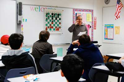 GM Dmitry Gurevich gives a lesson to ICA Warren Junior Scholars